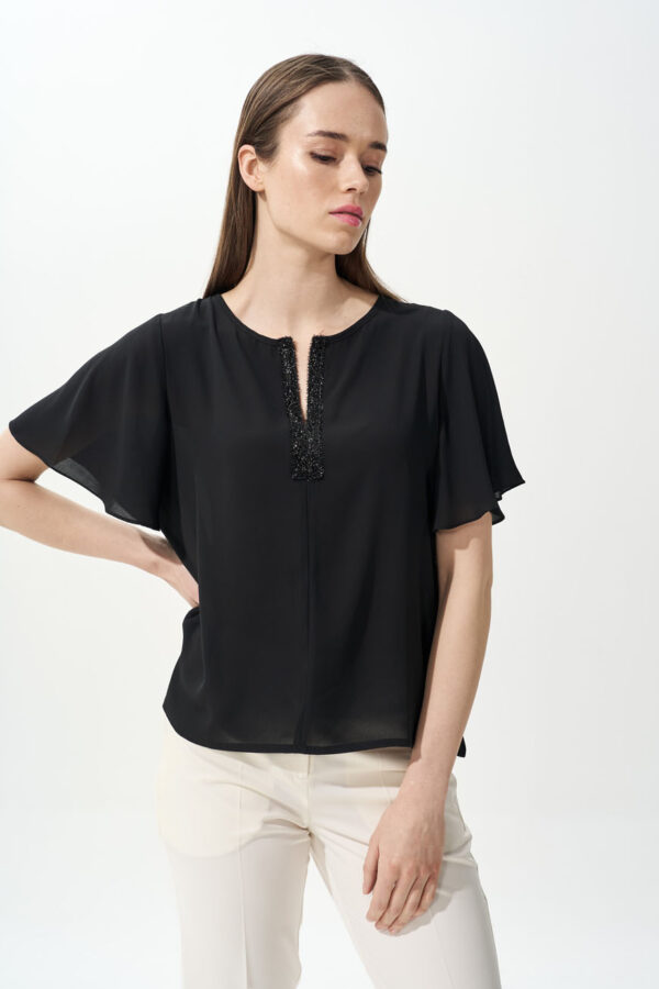 Top with ruffle sleeves